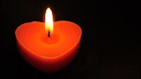 Single Small Heart Shaped Candle Burning Endlessly